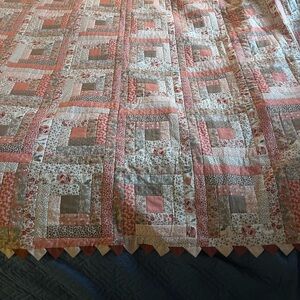 Cottagecore Floral Patchwork Quilt with detailed trim.